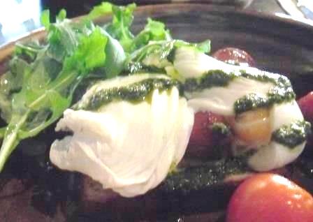 Two before Ten breakfast of poached eggs, balsamic tomatoes, and pesto dressing