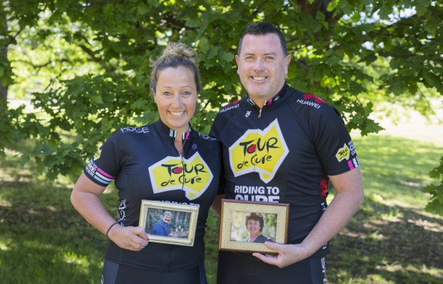 Tour de Cure 2017 team - Meg (with a photo of her Dad), and Andrew (with a photo of his Mum)